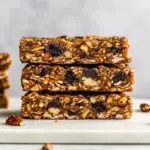 Homemade Chewy Granola Bars With Pecans, Raisins, and Chocolate Chips photo