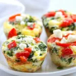 Homemade Egg Muffins with Kale, Roasted Red Peppers, and Feta Cheese photo