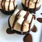 Homemade Fugdy Brownie Stuffed Banana Cupcakes with Toasted Marshmallow Frosting photo