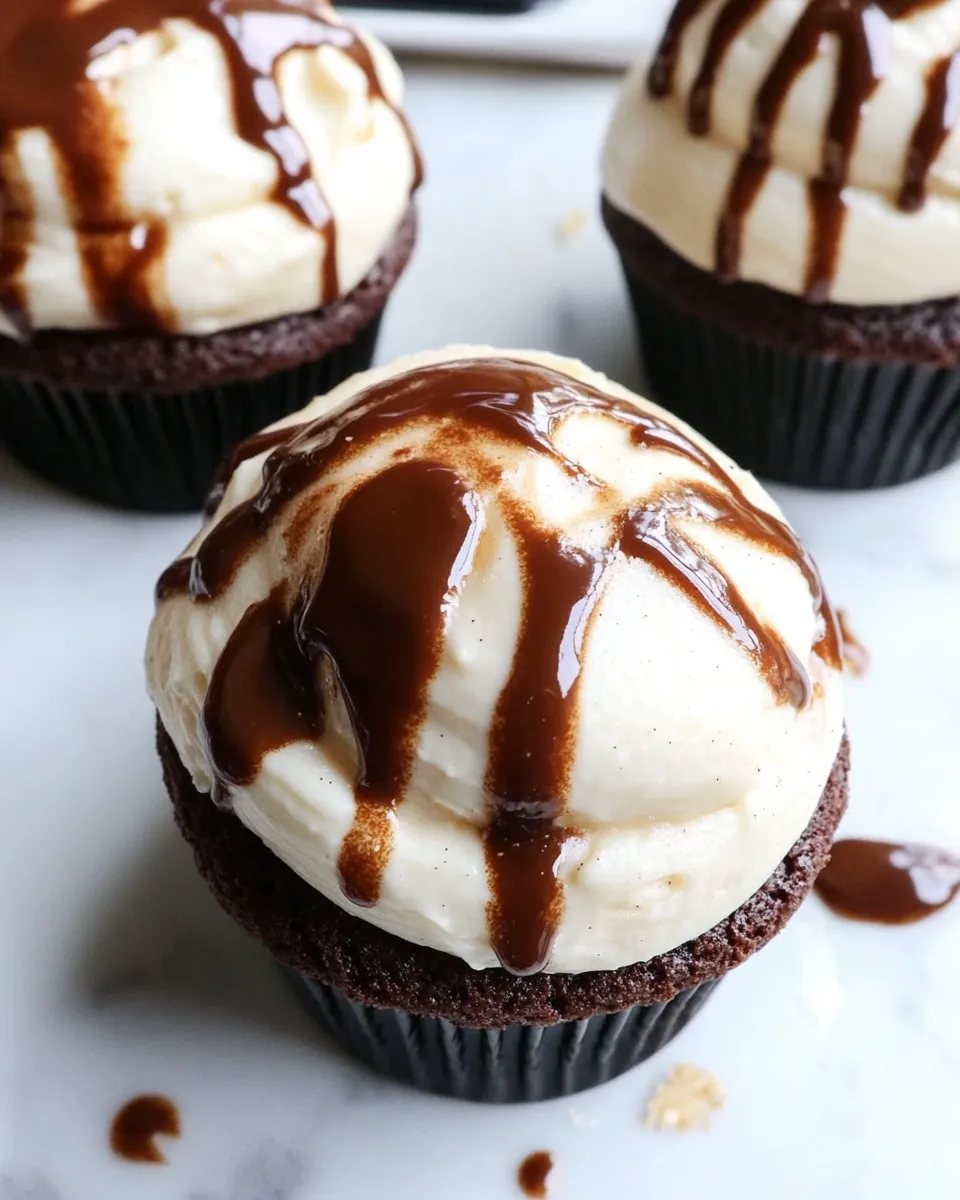 Delicious Fugdy Brownie Stuffed Banana Cupcakes with Toasted Marshmallow Frosting shot