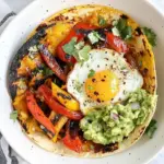 Homemade Spicy Breakfast Fajitas with Eggs and Guacamole photo