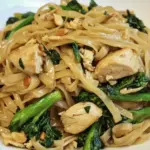 Homemade Thai-Style Stir-Fried Noodles with Chicken and Broccolini photo