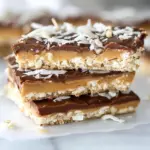 Homemade Toasted Coconut Caramel Peanut Butter Snickers Bars photo