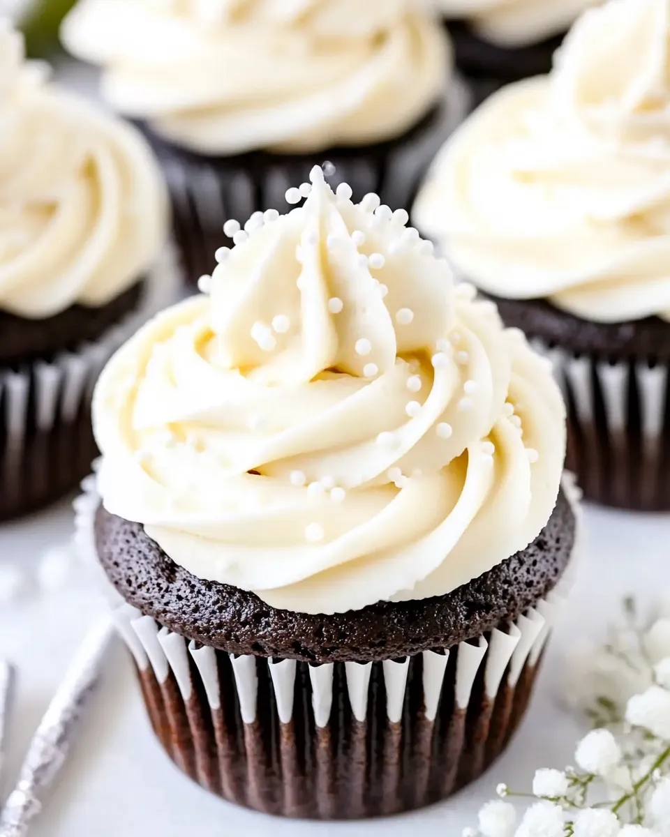 Homemade Vanilla Buttercream Topped Cocoa Cupcakes photo