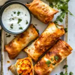 homemade Baked Buffalo Chicken Egg Rolls with Cilantro Lime Ranch. photo