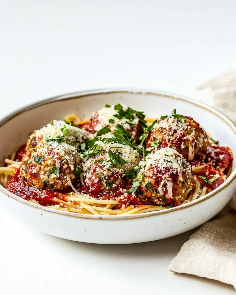 Homemade Baked Chicken Parmesan Meatballs with Roasted Garlic Spaghetti. photo