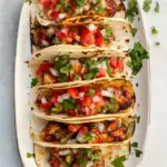 Homemade Crispy Cheesy Chicken Tacos. recipe photo