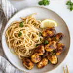 homemade Crispy Lemon Chicken Bites & Spaghetti. photo