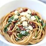 homemade Spaghetti with Sun Dried Tomatoes & Spinach photo